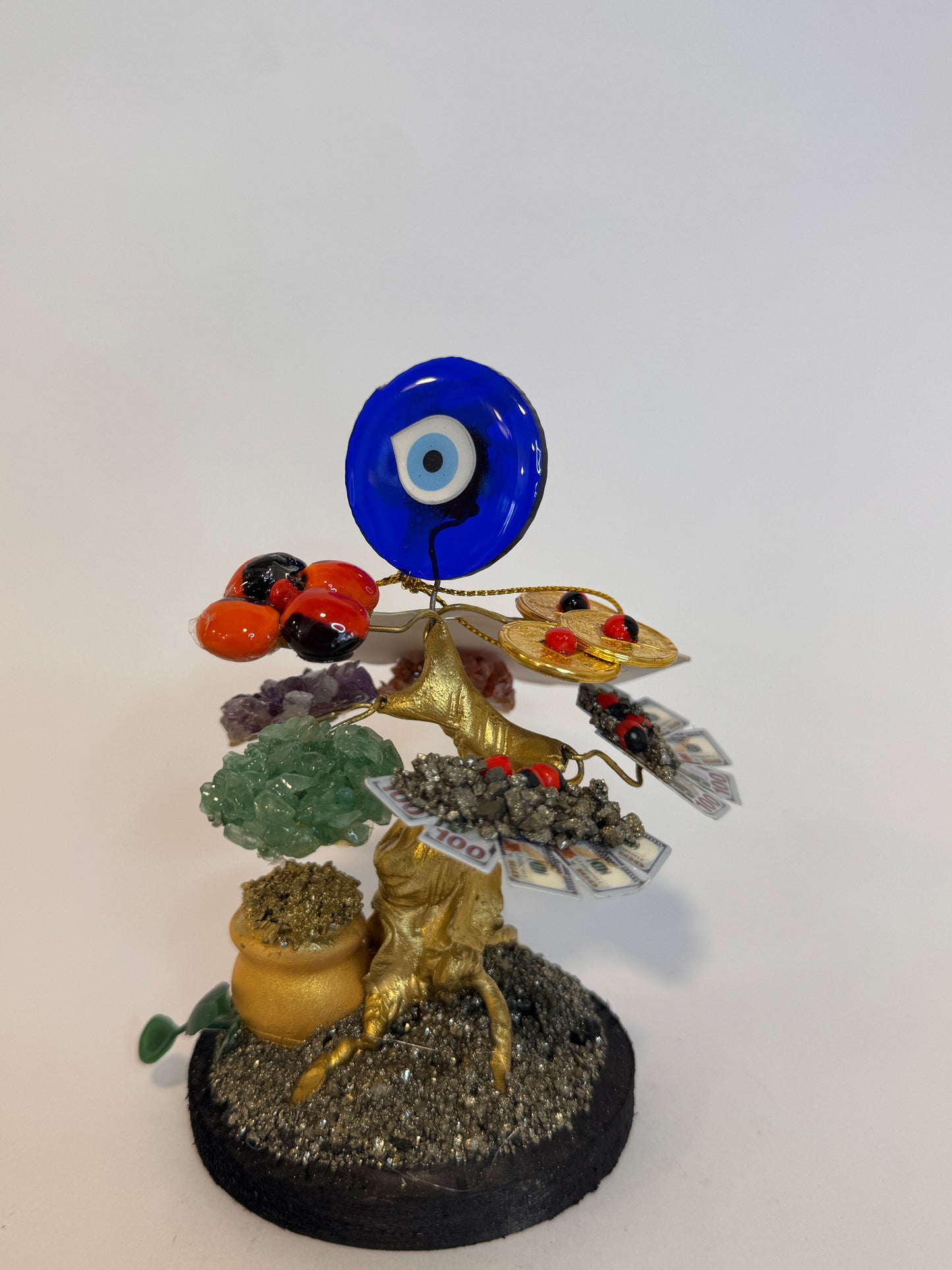 Árbol de la Prosperidad con Ojo Turco Amuleto decorativo que combina abundancia y protección, atrayendo fortuna mientras aleja las energías negativas